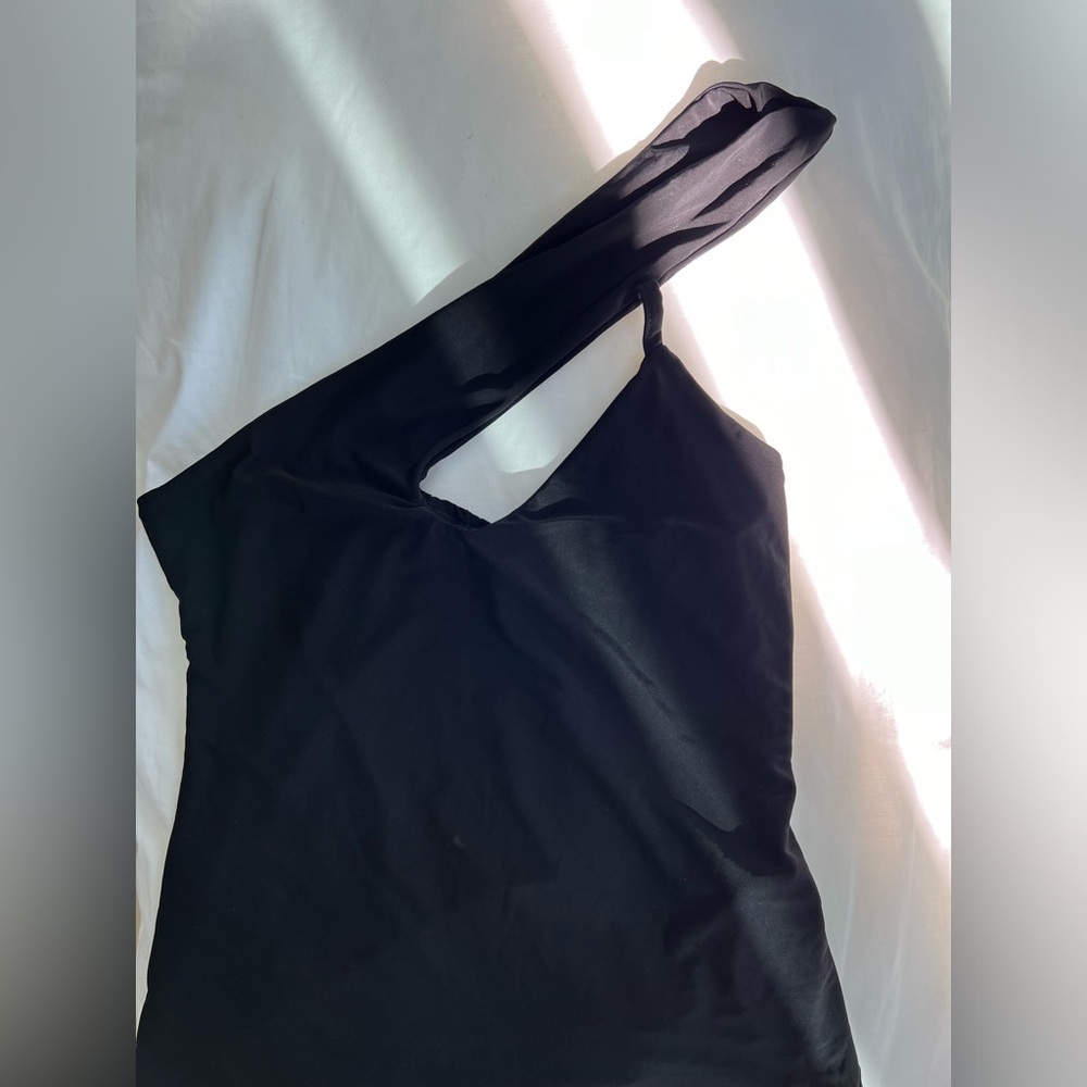 One strap body suit.